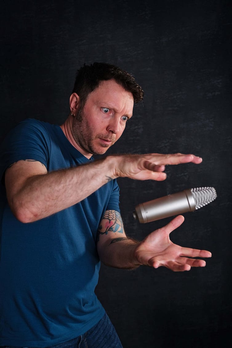 A man with a microphone in his hand.
